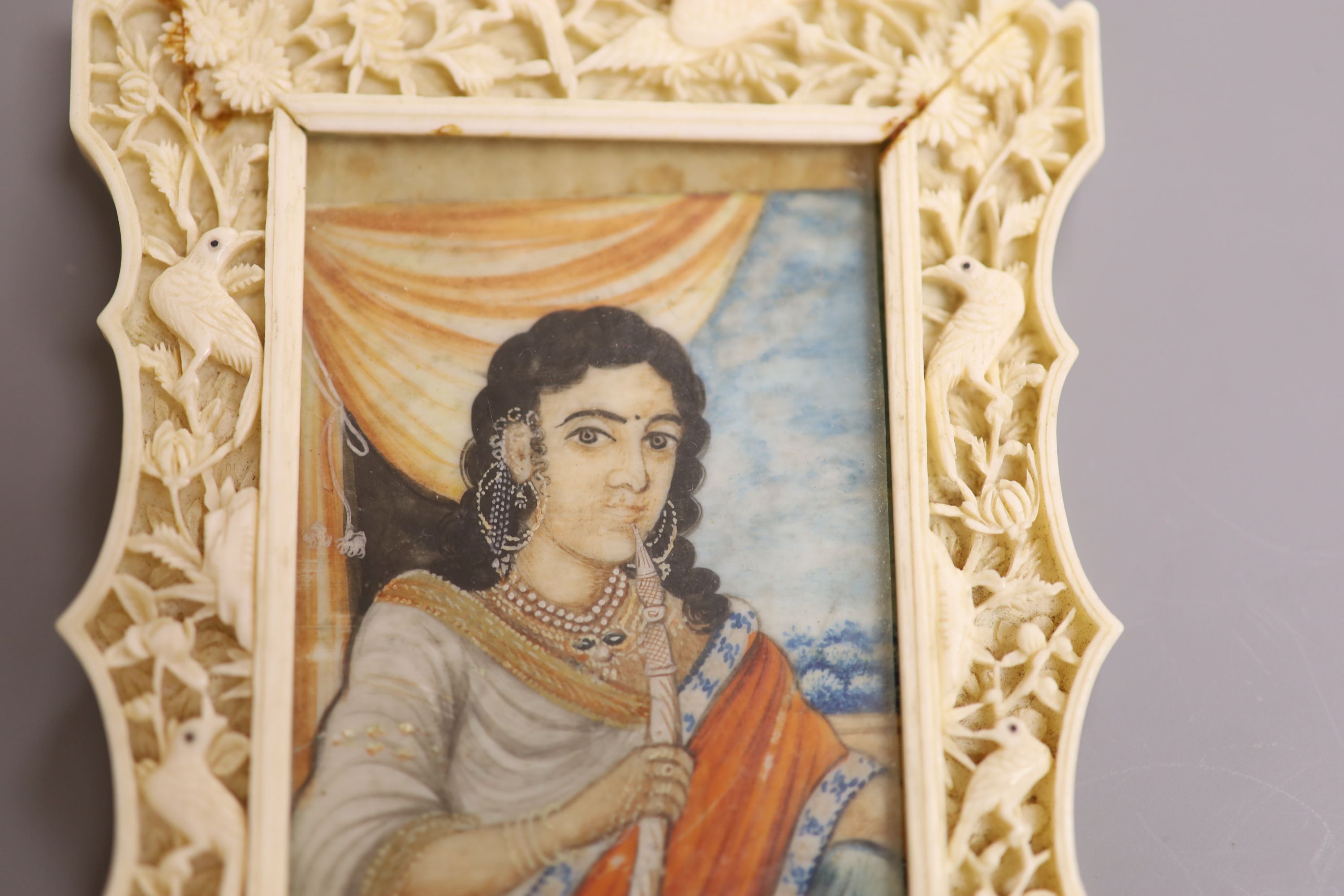 An Indian miniature gouache on ivory in a Chinese Ivory frame, circa 1900 8 x 5.5cm